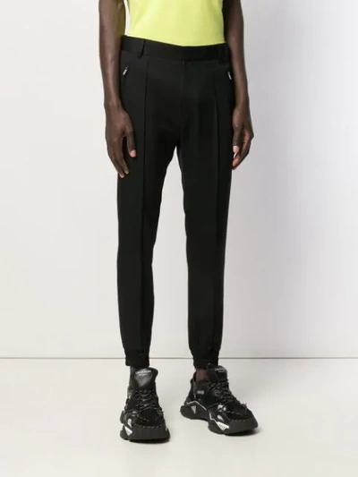 Shop Juunj Tapered Trousers In Black