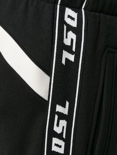 Shop Diesel Logo Tape Track Pants In Black