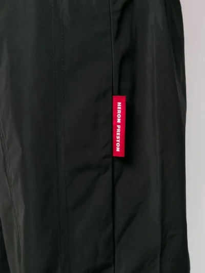 Shop Heron Preston Logo Tag Straight-leg Trousers In Black