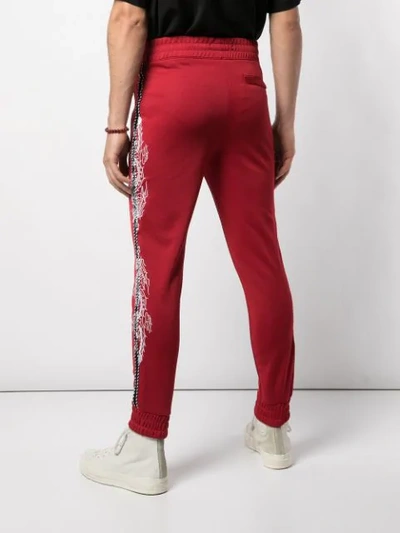 Shop Amiri Souvenir Track Pants In Red