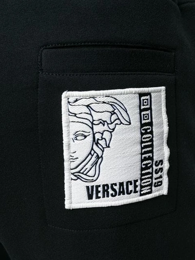 Shop Versace Medusa Logo Patch Track Trousers In Black