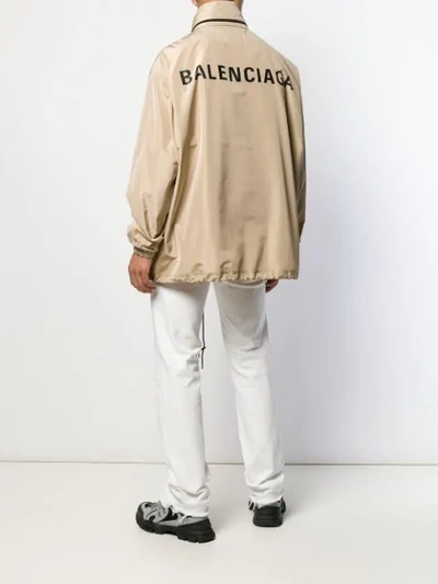 Shop Balenciaga Logo Raincoat Jacket In Neutrals