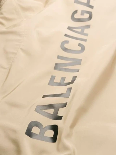 Shop Balenciaga Logo Raincoat Jacket In Neutrals