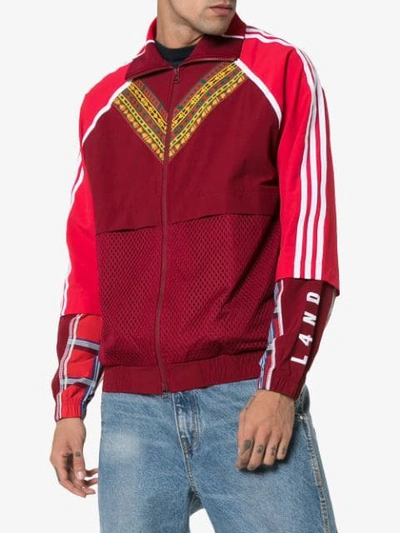 Shop Adidas Originals Adidas X Pharrell Afro Hu Joggingjacke Mit Kontratsstreifen - Rot In Red