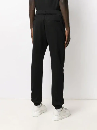 Shop Versace Printed Logo Track Trousers In Black
