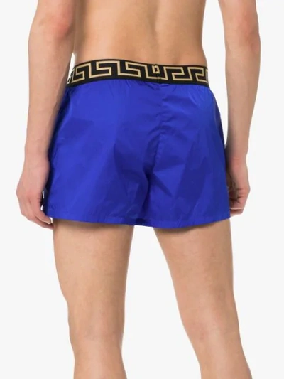 Shop Versace Logo Waist Swim Shorts In Blue