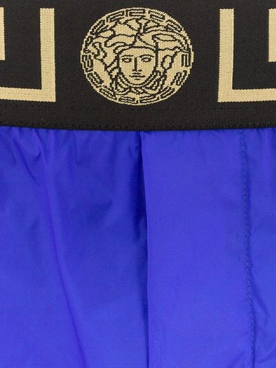 Shop Versace Logo Waist Swim Shorts In Blue