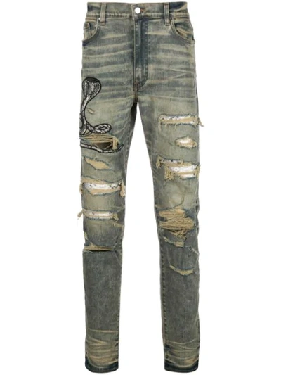 Shop Amiri Distressed-jeans Mit Kobra In Blue
