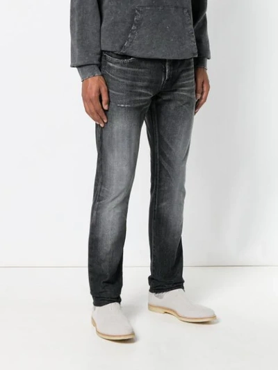 Shop Saint Laurent Faded Straight-leg Jeans In Black
