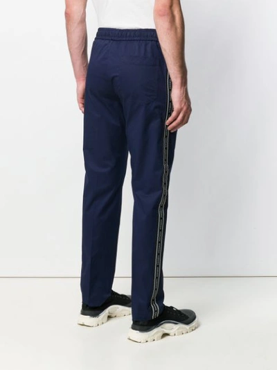 Shop Versace Logo Tape Track Pants In Blue