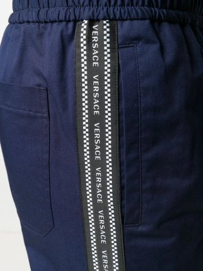 Shop Versace Logo Tape Track Pants In Blue