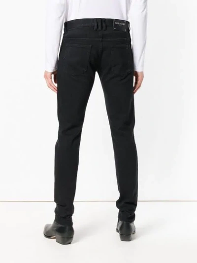 Shop Balmain Distressed Slim Jeans In Black