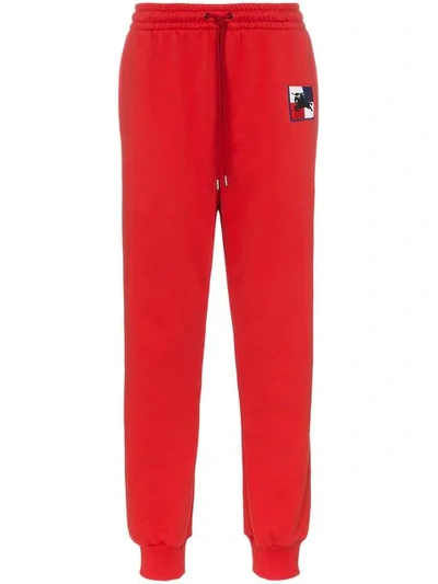 Shop Burberry Embroidered Logo Track Pants In Red