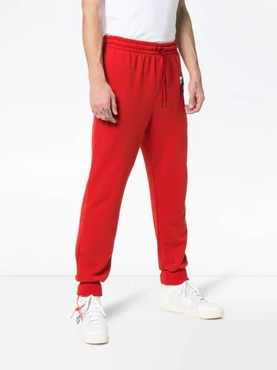 Shop Burberry Embroidered Logo Track Pants In Red