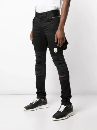 Shop Undercover Distressed Skinny Trousers In Black