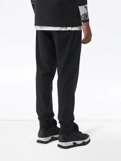 Shop Burberry Logo Print Track Pants In Black