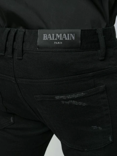 Shop Balmain Distressed Skinny Jeans In Black