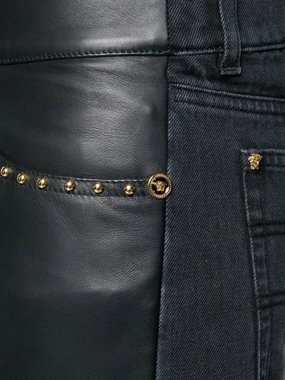 Shop Versace Straight Studded Trousers In Black