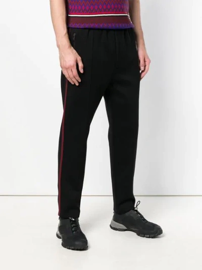 Shop Prada Side Stripe Slim Trousers In Black