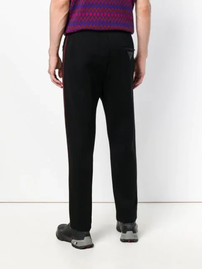 Shop Prada Side Stripe Slim Trousers In Black
