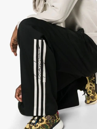 Shop Y-3 Wide Leg 3-stripe Sweatpants In Black