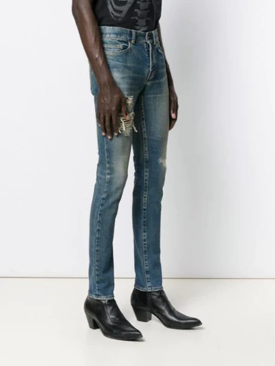 Shop Saint Laurent Ripped-detail Skinny Jeans In Blue