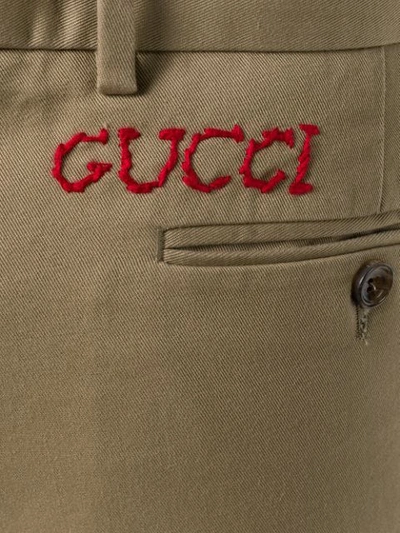 Shop Gucci Embroidered Logo Chinos In Neutrals