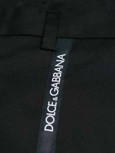 Shop Dolce & Gabbana Logo Strap Trousers In N0000 Nero.