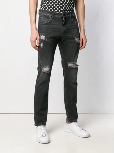 Shop Dolce & Gabbana Distressed Jeans In Black