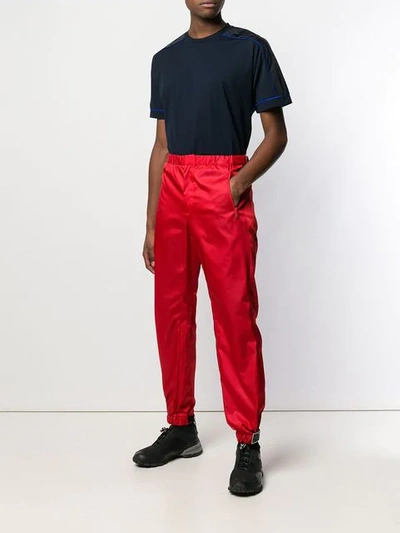 Shop Prada Shiny Tapered Trousers In F0aa6 Red