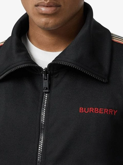 Shop Burberry Icon Stripe Detail Funnel Neck Track Top In Black