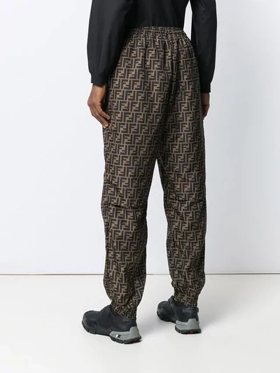 Shop Fendi Ff Print Track Pants In Brown