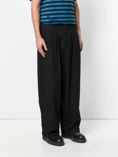 Shop Yohji Yamamoto Loose Fit Trousers In Black