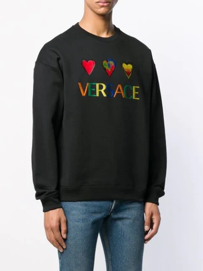 Shop Versace Hearts And Logo Embroidered Sweatshirt - Black
