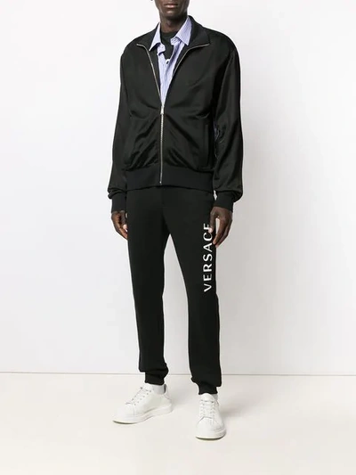 Shop Versace Medusa Strap Detail Track Jacket In Black