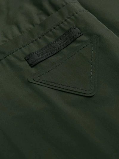 Shop Prada Touch-strap Technical Trousers In Green