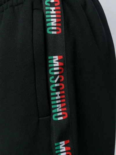 Shop Moschino Italian Logo Track Pants In Black