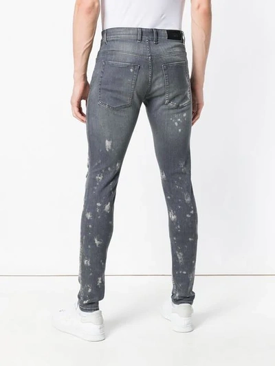 Shop Represent Distressed Skinny Jeans In Grey