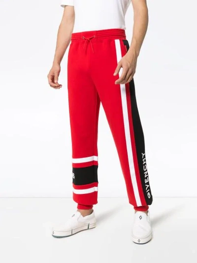 Shop Givenchy Logo Stripe Track Pants In Red