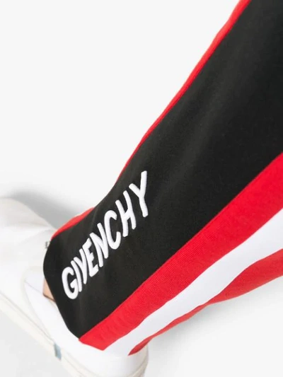 Shop Givenchy Logo Stripe Track Pants In Red