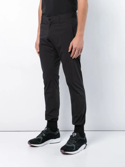 Shop Engineered For Motion Cooperator Track Pants In Black