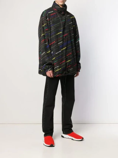 Shop Balenciaga Logo Print Oversized Raincoat In Black