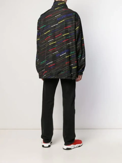 Shop Balenciaga Logo Print Oversized Raincoat In Black