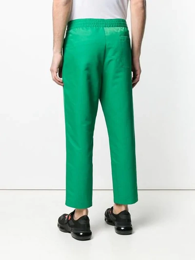 Shop Prada Cropped Track Style Trousers In Green