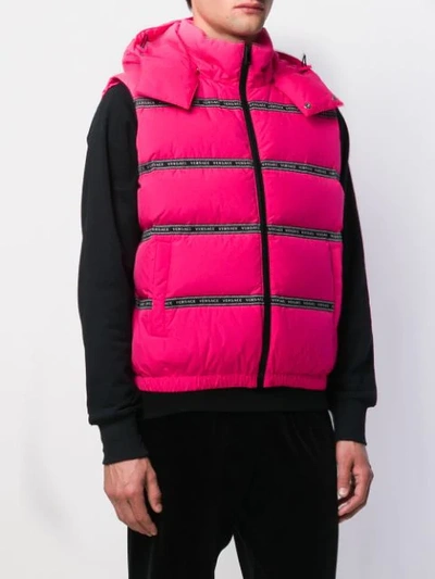 Shop Versace Puffer Logo Tape Gilet Jacket In Pink