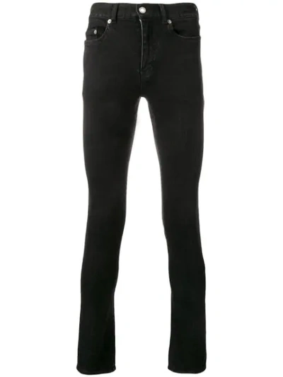 Shop Saint Laurent Low-rise Skinny Jeans In Black