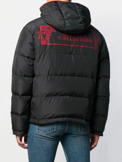 Shop Versace Zipped Padded Jacket In Black