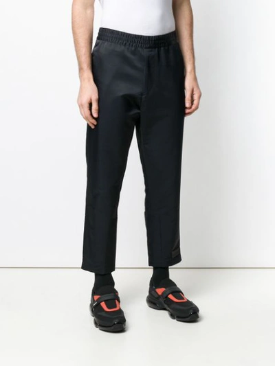 Shop Prada Cropped Track Style Trousers In Black