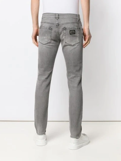 Shop Dolce & Gabbana Distressed Skinny Jeans In Grey