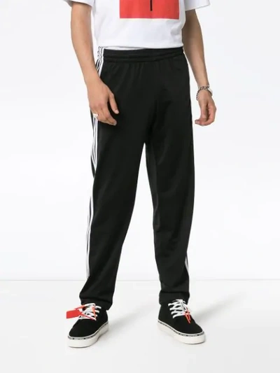 Shop Adidas Originals Firebird Side-stripe Track Pants In Black